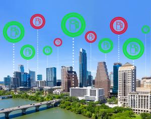 A city skyline showing icons representing the locations and status of EV charging stations