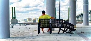 RICKRHODES takes picture of man sitting on the Pier in Fort Myers, Florida, after Hurricane Ian