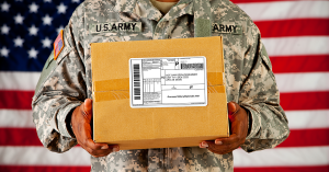 US Soldier Holding Box with Shipping Label