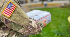 US Service Member Holding a Care Package