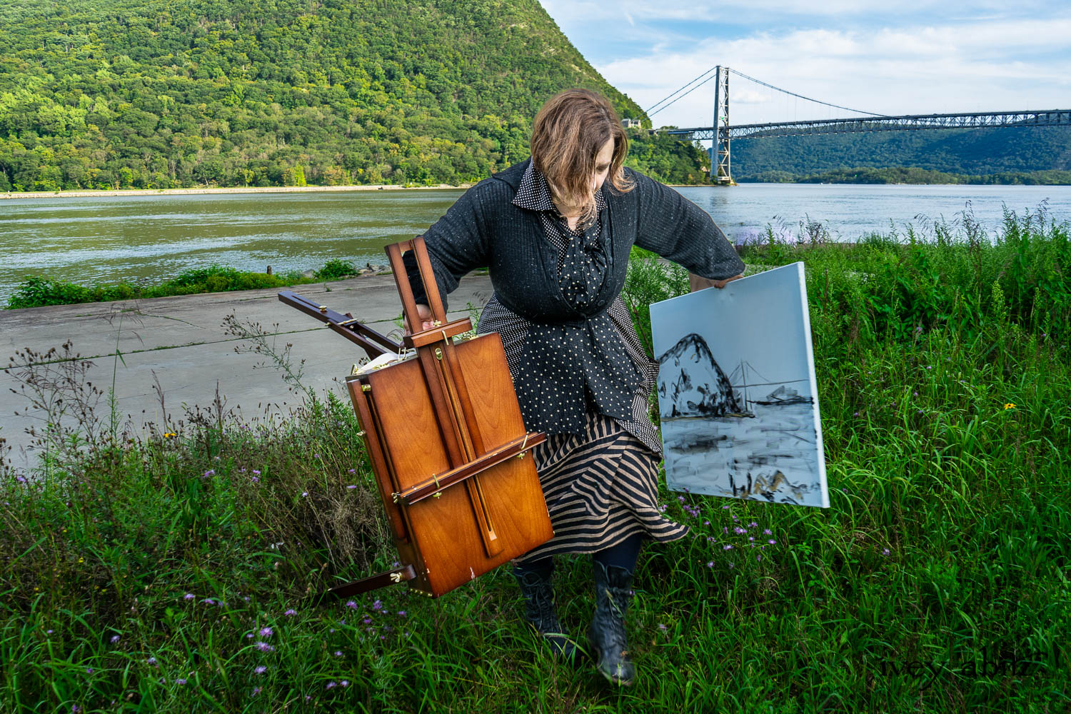 Artist designer Cynthia Ivey Abitz painting Anthonys Nose and Bear Mountain Bridge on the banks of the Hudson River.