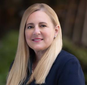 Headshot photo of Heather Rivard, senior vice president, Transmission & Distribution, Southern California Edison. She has blonde hair and is wearing a blue blazer.