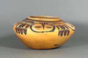 Large, circa 1910 Nampeyo of Hano Hopi baluster form pottery jar in yellow slip, decorated with pictographic designs in brown and burnished, 7 inches tall ($7,995).
