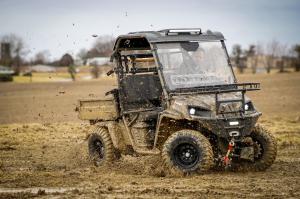 Landmaster 4x4 AMP UTV driving through mud.