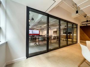 Shawmut's NYC Office is Enhanced by the Seamless Integration of Acousti-Clear's Elegant Design.