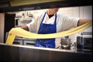 Kiko Pulixi, son of owners, pasta "magician", rolls out pasta to make his signature raviolis