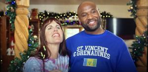 Film still image of Will Blagrove as Akeem Baptiste with Pamela Witte in THE CHRISTMAS CLASSIC