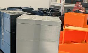 Unassembled Bitcoin Space Heaters XL with a stack of silent Noctua and Arctic fans