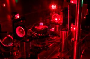 red laser beam on an optical table in a laser lab