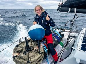 Rosalin Kuiper on Team Malizia during The Ocean Race, getting the surface drifter buoy ready for deployment. © Antoine Auriol / Team Malizia / The Ocean Race