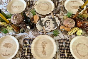 A sustainable holiday table setting featuring seasonal squash and maaterra plates.