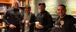 Police officer from Goodyear getting coffee with other community members