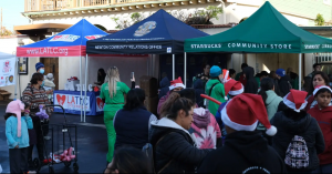 The LATLC, LAPD, and Starbucks booths contributing to the Los Angeles community for LATLC's "Comfort & Joy" Event.