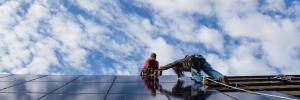 solar panels installed by two men on virginia property