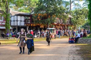 People enjoying the Texas Renaissance Festival at its 55-acre recreation of a 16th Century European village, one hour north of Houston