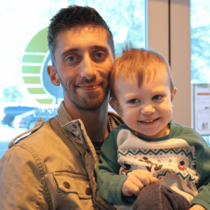 father and son inside front door of Whats Crackin Cafe in Mesa