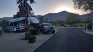 5th Wheel Trailer set up at RV resort with golf course in background
