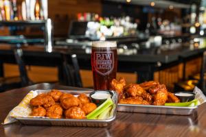 PJ Whelihan's famous wings in two flavors alongside the signature beer, PJW Copper Lager, brewed by Victory Brewing Company.