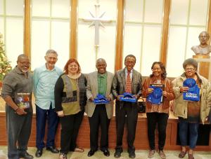 This is a photo of community group leaders with Youth For Human rights Materials donate to them as a public service.