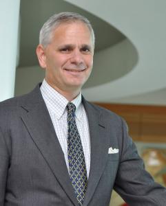 A photograph of Neal Neilinger, President, FORCE Private Credit
