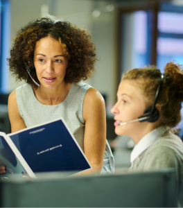 Two women are having a conversation at work.