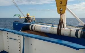 Image of one of the three SMART cable instrumented repeaters being deployed.