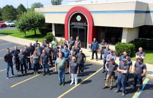 Magnetic Products, Inc Staff in front of MPI headquarters in Highland, MI