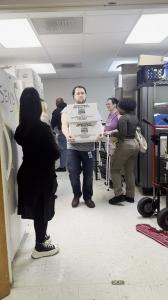 Brian Goodlett carries some boxes at the Salvation Army food packing event.