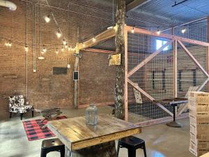Interior view of Stumpy’s Hatchet House Judson Mill with multiple axe-throwing lanes.