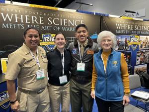 NPS NPS President Retired Vice Adm. Ann Rondeau and students from the Naval Postgraduate School gather at the NPS booth during the annual WEST 2024 Conference.