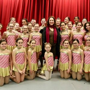 Cristina at rehearsals with young dancers dressed like Rockettes before going on-stage at Carnegie Hall