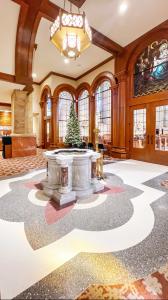 Terrazzo floor in an 1880 church interior with stone block walls and painted ceiling.