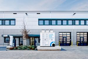 Adaptive Balancing Power Headquater in Pfungstadt Germany with a high-performance flywheel energy storage and charging system in front.