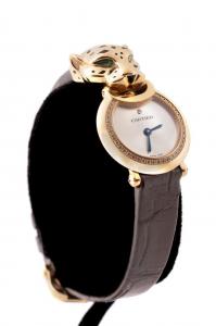 Cartier La Panthere 18k yellow gold, diamond, and tsavorite wristwatch with Swiss-made quartz movement, a silver dial, and diamond bezel incorporating 39 diamonds (est. $10,000-$20,000).