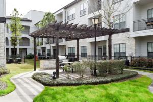The pet-friendly community also offers its residents a multi-level parking garage, a lush courtyard, a covered outdoor kitchen with gas grill, and more.