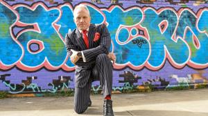 Brian Rose, London Mayoral candidate, poses with graffiti