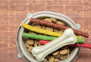 Various dog and cat treats in a bowl.