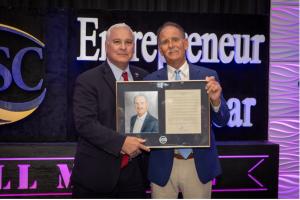 Indian River State College President Dr. Timothy Moore and  Entrepreneur of the Year Award winner 2024 William “Bill” Marine (Photo Credit: Denise Ritchie)