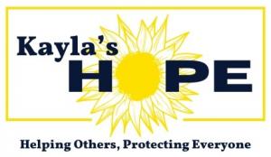 A logo for Kayla's HOPE, featuring a sunflower and the text "Helping Others, Protecting Everyone"