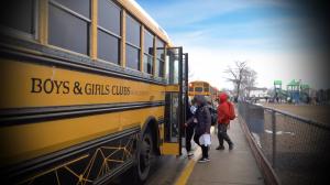Boys & Girls Clubs of Weld County bus picking up kids after school.