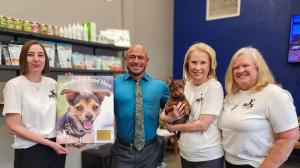 (L to R) Charlott Knowland, Feeding Pets case manager, Steven Kiley, Sierra Veterinary Hospital Human Services Director, Genevieve Frederick, Feeding Pets Founder and President, and Laura Brown, Feeding Pets Executive Director with commemorative plaque.