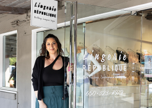 Natalie Torres stands in front of her new store at Town & Country Village