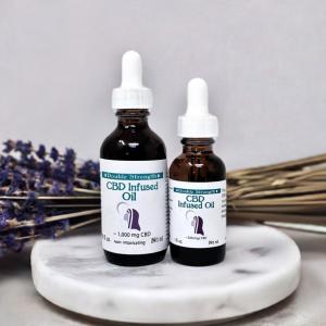 a bottle of CBD oil with dried lavender flowers nearby