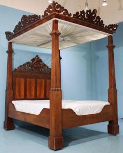 Mahogany plantation full tester bed with a carved headboard and pierce carved gallery around the top, 103 inches tall by 71 ½ inches long by 63 inches wide (est. $4,000-$8,000).