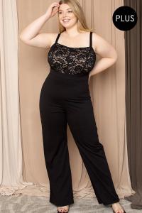 A woman modelling a black plus size jumpsuit