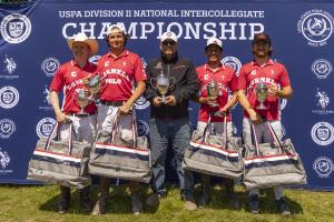 Cornell university arena polo team poses with their coach, trophy and USPA Pro gear bags