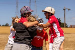 arena polo players and Cornell fans jump up and down in celebration of their team's win