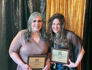 Anne Albarran and Amanda DeMar with their award plaques.