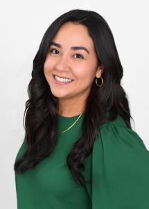Kenya Hamann, a bilingual real estate agent, smiles confidently in a professional headshot, bringing her expertise and commitment to Astra Realty's McKinney, TX team.