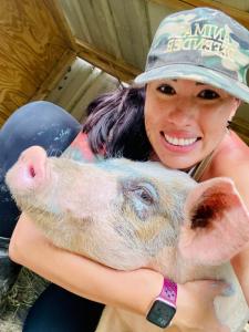 Karol, with pig Laz who was rescued from slaughter